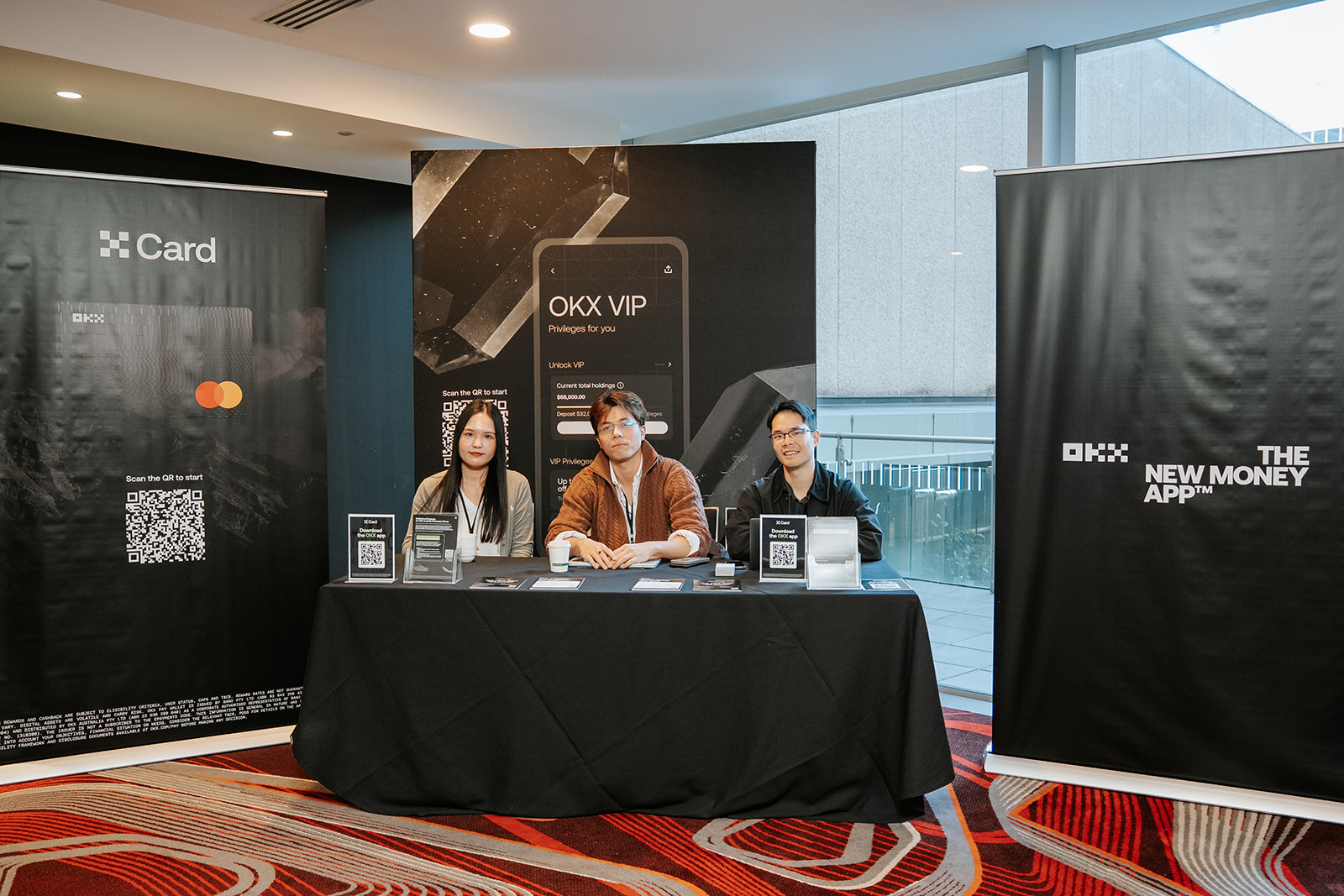 OKX team at their branded exhibitor booth