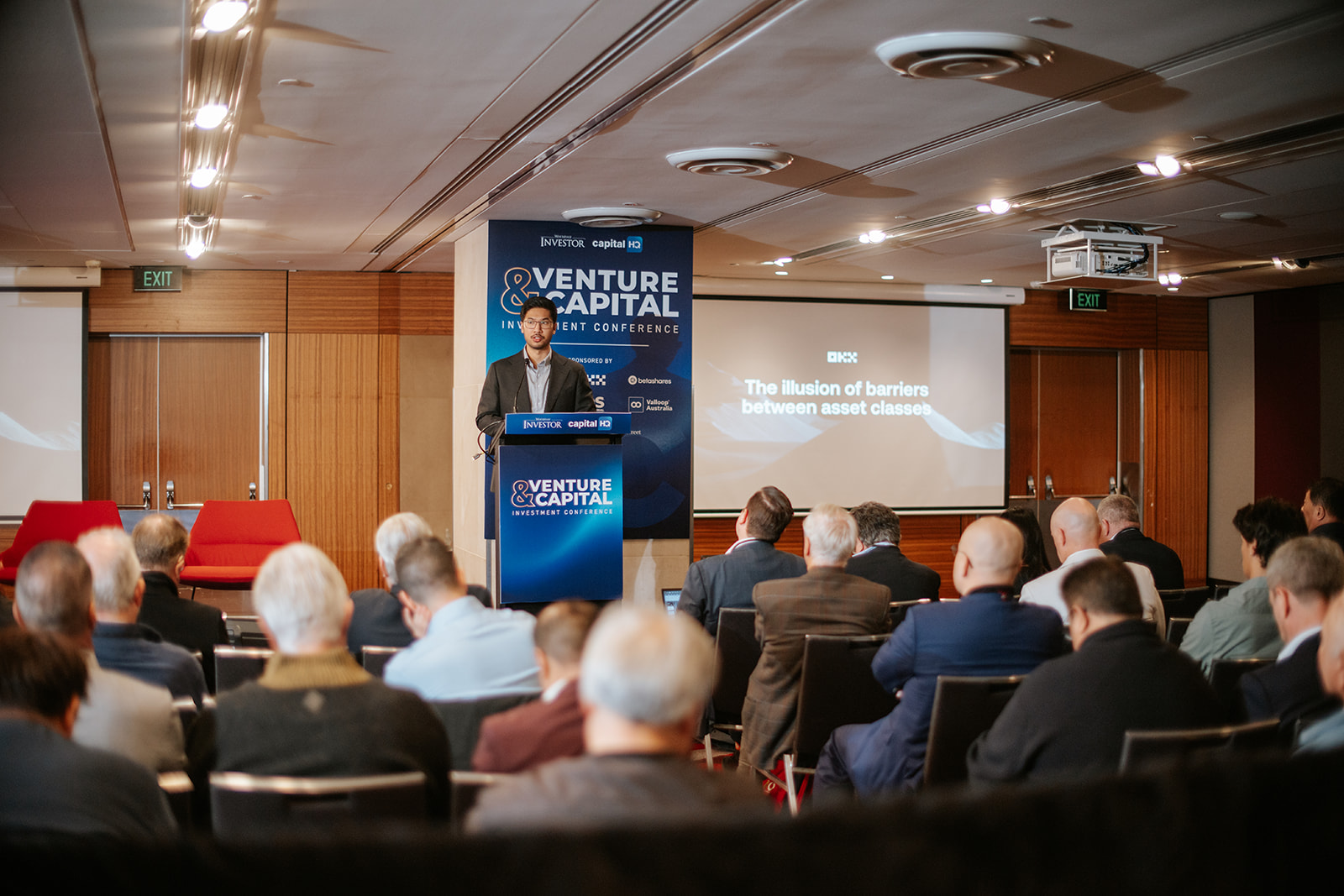 OKX speaker presenting on stage at Venture & Capital